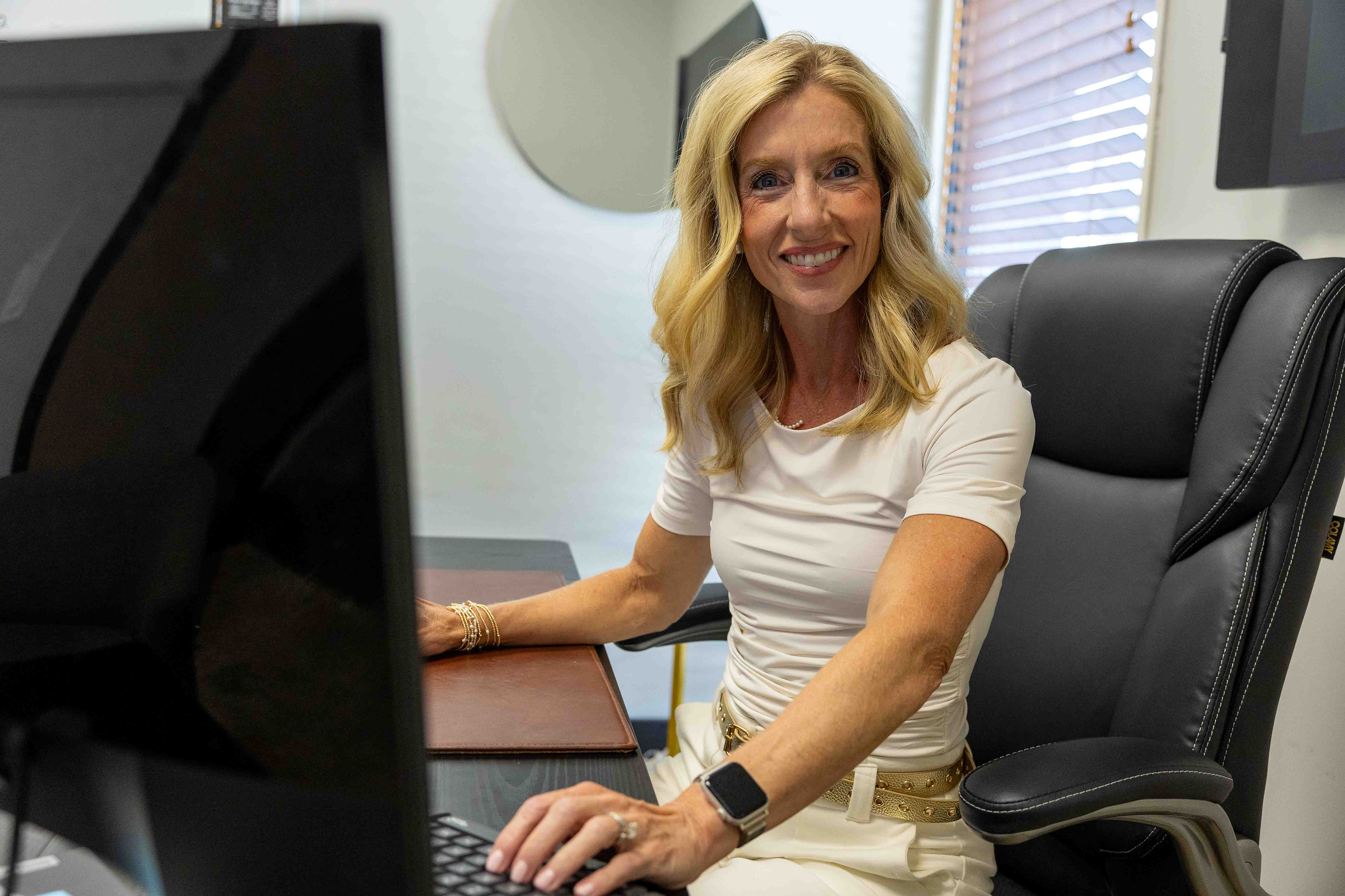 Laura Chastain, RN, FNP-BC in her office